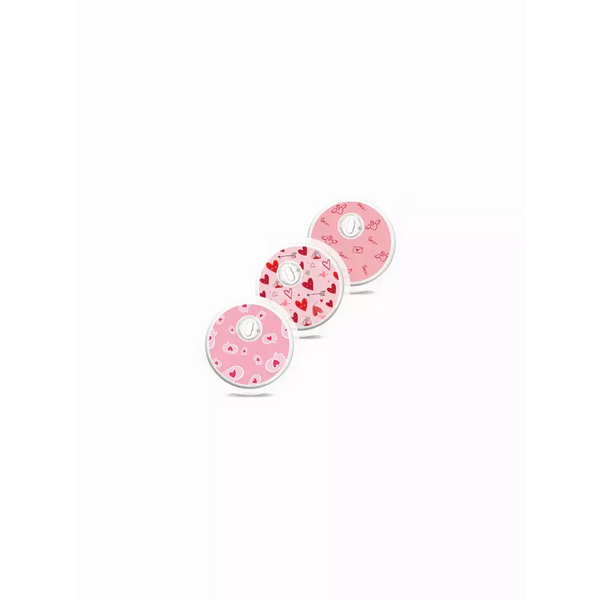 Valentine-themed Freestyle Libre 3 sensor stickers in pink and red designs.