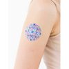 Freestyle Libre 3 adhesive patch in vibrant spring design on arm.