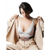 Elegant lace insulin pump pouch worn under a beige jacket, showcasing discreet style and functionality.