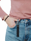 Diabetes T1 leather keychain attached to denim jeans, promoting diabetes awareness.