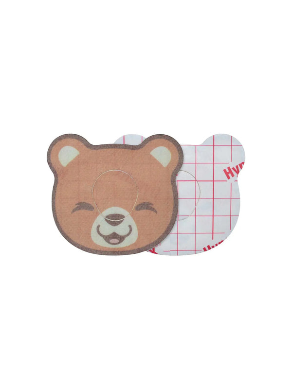 Dexcom G7 bear patch front and back view showing adhesive backing and protective CGM design for children