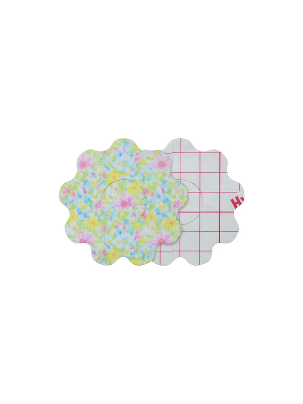 Freestyle Libre 3 flower overpatch front and back view showing adhesive layer and colorful protective design