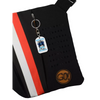 Medical Awareness Keychain - Surviving On Insulin design attached to a black and red bag.
