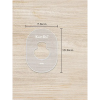 CGM Sensor Patch Template on wooden background with dimensions 7.5cm by 10.3cm.