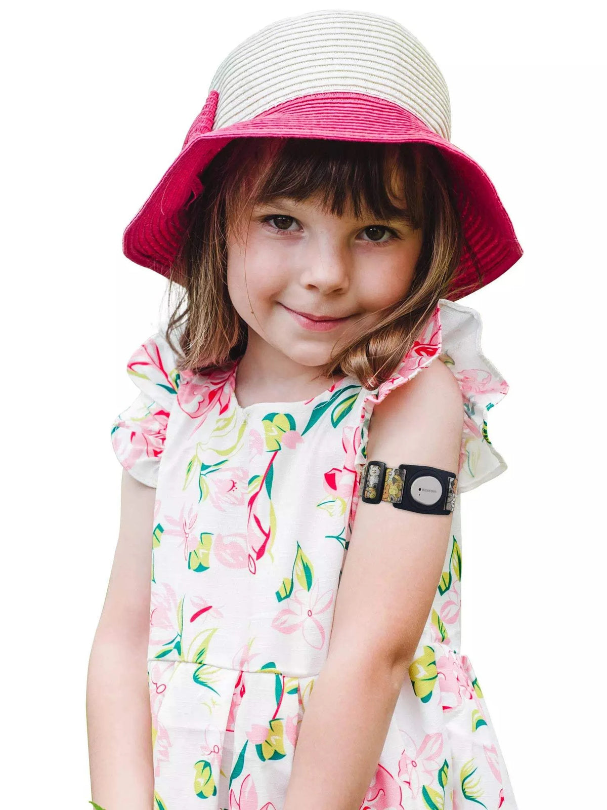 Child wearing Dexcom G7 Armband with rotating clip, playful design, floral dress, and pink hat.