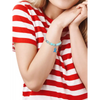 Diabetic awareness bracelet with beads on a woman's wrist in a striped shirt.