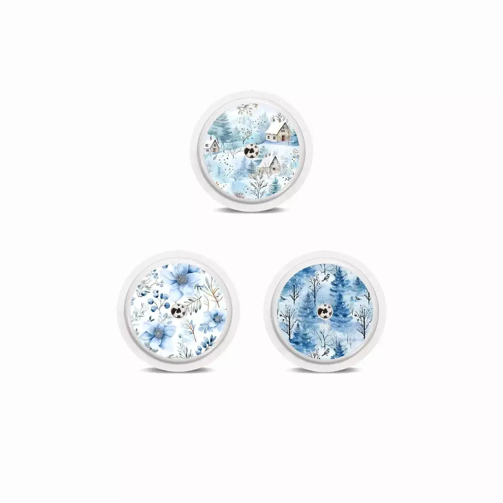 Winter-themed Freestyle Libre 2 sensor stickers showcasing snow-covered landscapes and frost patterns.