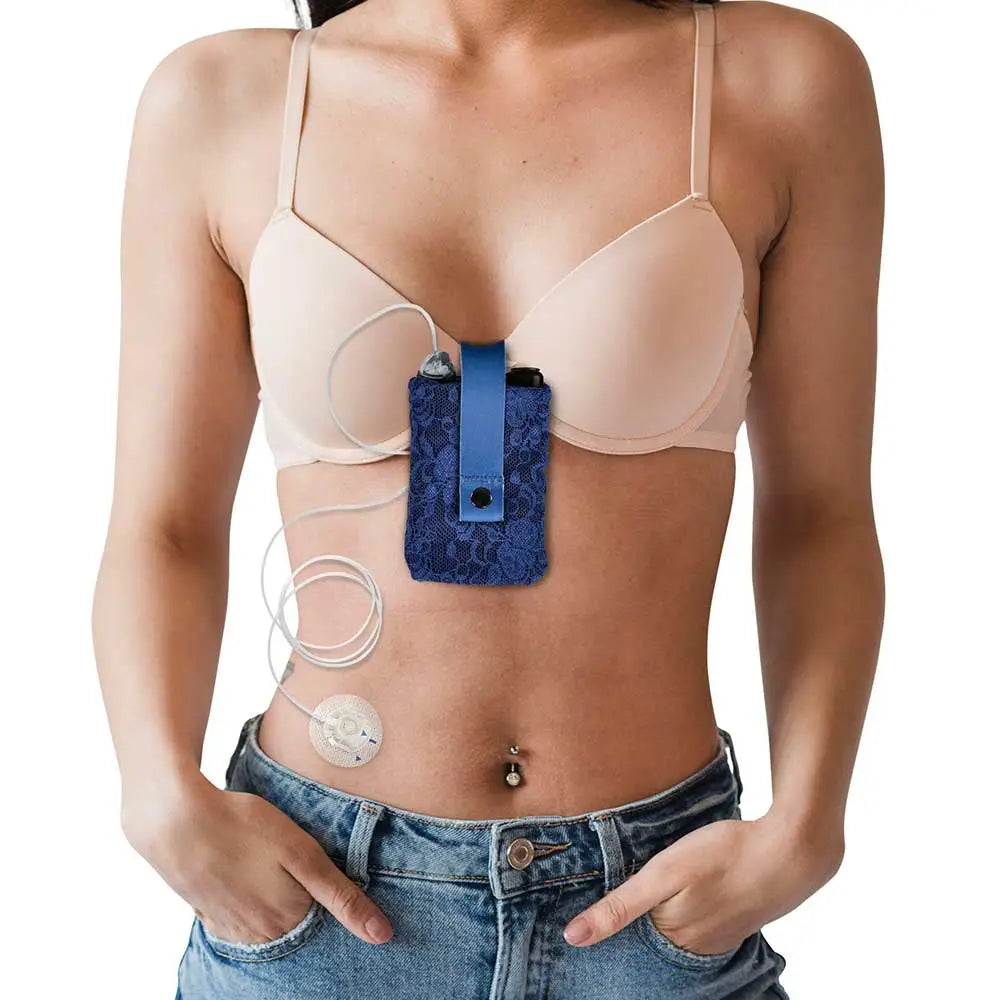 Insulin pump lace bra pouch attached to woman's bra for easy access and comfort.