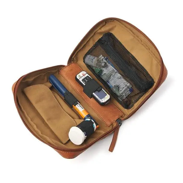 Leather diabetes backpack with organized compartments for insulin, test strips, and medical essentials.