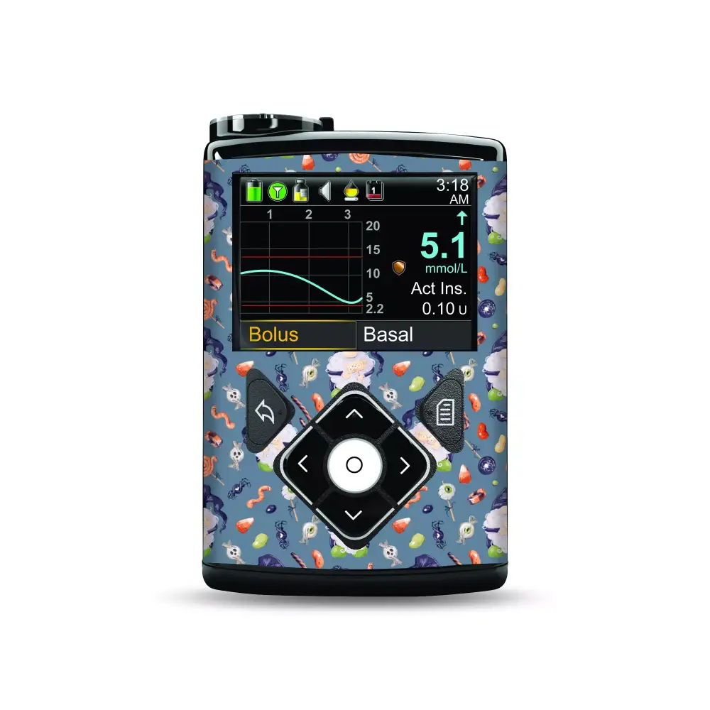 Medtronic MiniMed insulin pump with Halloween-themed stickers featuring bats, pumpkins, and ghosts.