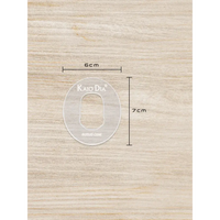 CGM sensor patch template for precise patch cutting on wooden surface.