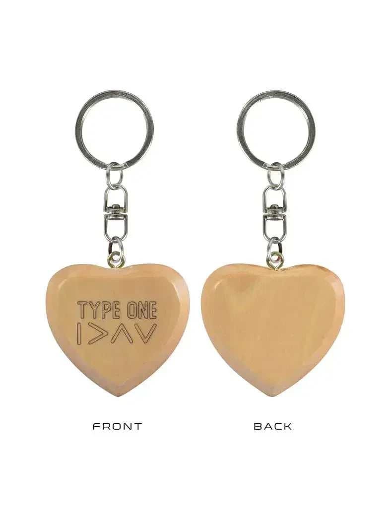 Heart-shaped wooden keychain for Type 1 diabetics with "Type 1 >∧∨" engraving, durable and compact.