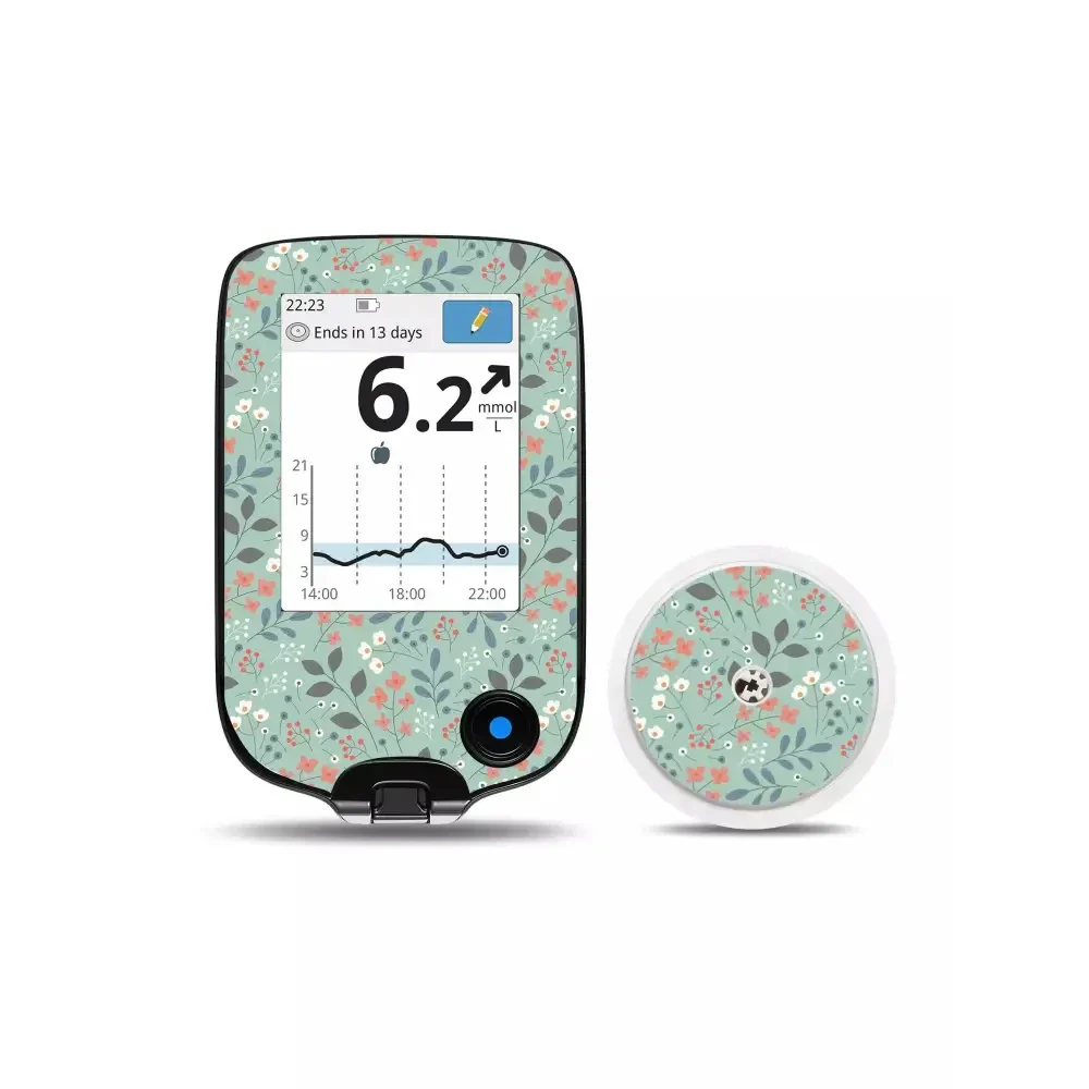 Freestyle Libre Reader with Spring Edition floral sensor sticker in green and pink tones.