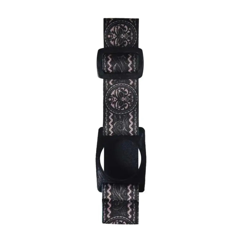 The Freestyle Libre 2 Armband with a decorative black and white pattern, showcasing the adjustable strap and sensor holder.